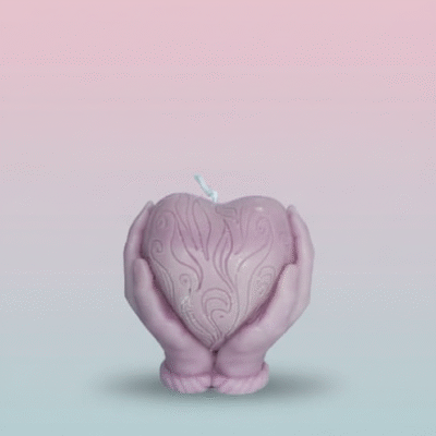 “Light purple scented wax candle shaped like hands holding a textured heart”