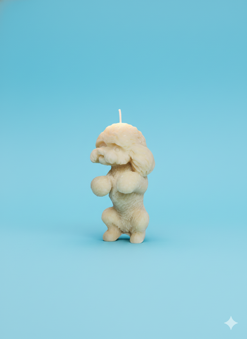 Handcrafted cream dog-shaped scented wax candle with detailed puppy sculpture design