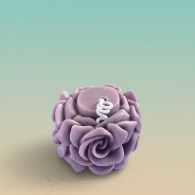 “Handcrafted purple rose-shaped scented wax candle with detailed floral petals”