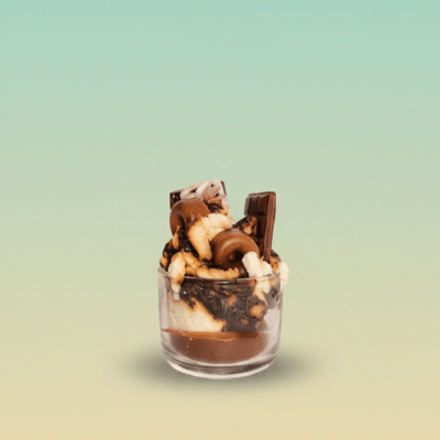 “Chocolate dessert-style scented wax candle with brownie chunks and chocolate bar toppers in a glass jar”