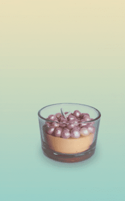 “Scented handcrafted wax candle designed like a layered caramel cream coffee dessert shot in a clear mini glass”