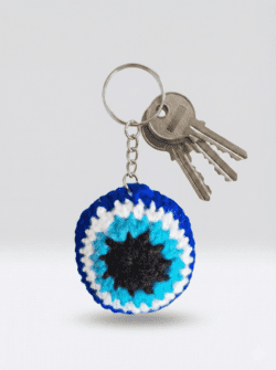 Buy handmade woolen round keychain with soft knitted design. Ideal for keys, bags, and gifting.