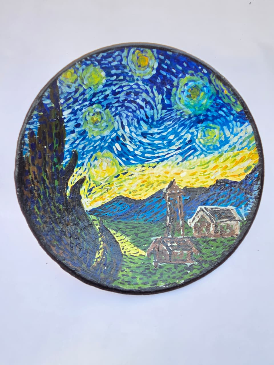 “Hand-painted terracotta wall plate inspired by Van Gogh’s Starry Night with textured night sky and village detailing”