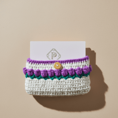 Handmade woolen card holder with button closure and knitted multicolour design