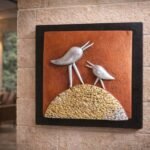 “Handmade terracotta bird wall art with textured base in contemporary folk design”