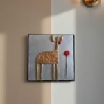 “Handmade terracotta animal wall art decorative piece in contemporary folk design”