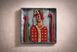 “Handmade terracotta woman wall art decorative panel with contemporary folk design and metallic accents”
