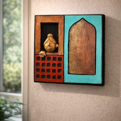 “Handmade terracotta wall art of a woman looking out of a window in contemporary folk design”