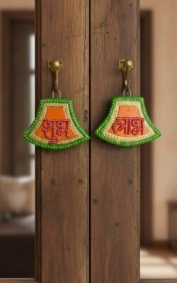 “Handcrafted Shubh Labh wall hanging with green, orange and gold detailing”