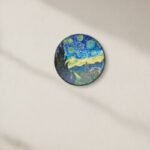 “Hand-painted terracotta wall plate inspired by Van Gogh’s Starry Night with textured night sky and village detailing”