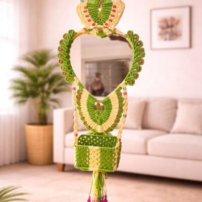 Handcrafted green and cream macramé mirror hanging with storage basket and tassels for wall décor