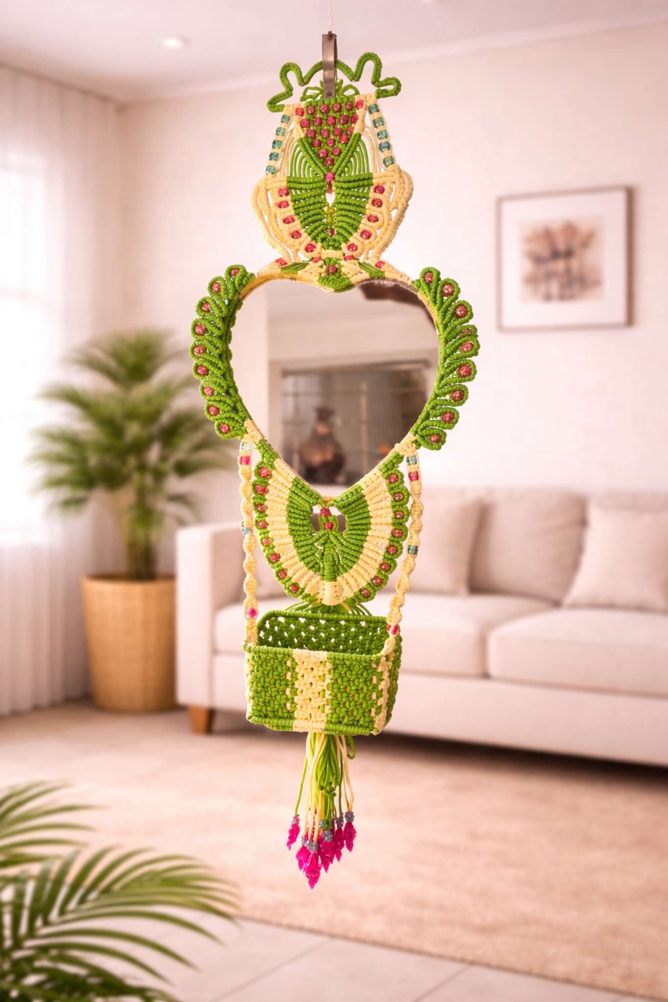Handcrafted green and cream macramé mirror hanging with storage basket and tassels for wall décor