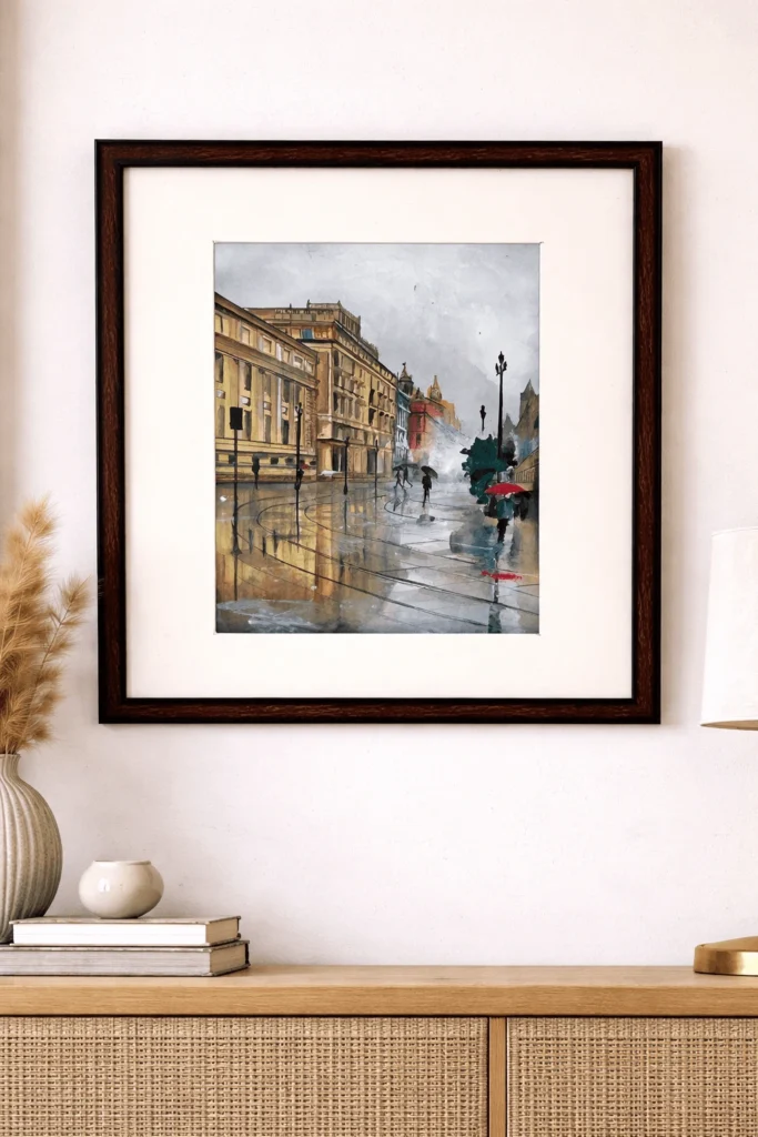 “Handmade watercolor and acrylic painting of a rainy European street with reflections and pedestrians, framed urban wall art by Jeel”
