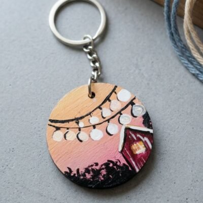 Handmade MDF round keychain with fairy lights and cozy house night design on wooden base