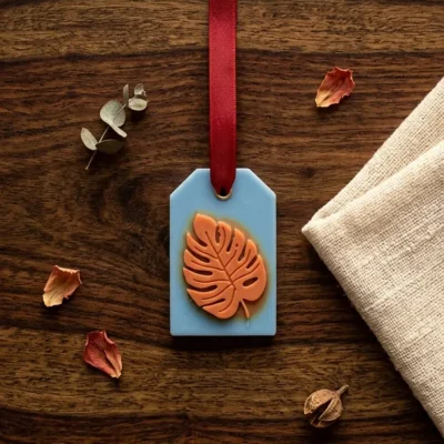 Hanging Handcrafted Wax Room Freshener – Blue Tag with Orange Leaf Design