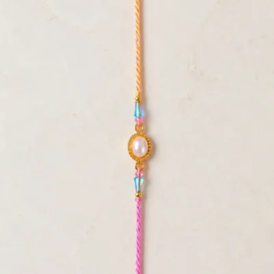 Handmade Pearl Oval Rakhi with Crystal Beads for Brother