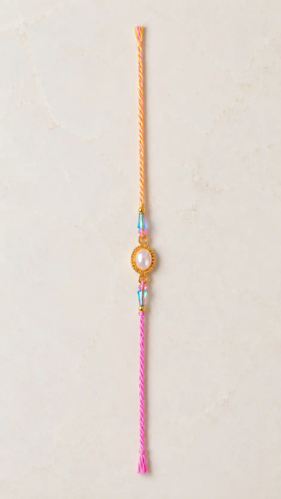 Handmade Pearl Oval Rakhi with Crystal Beads for Brother